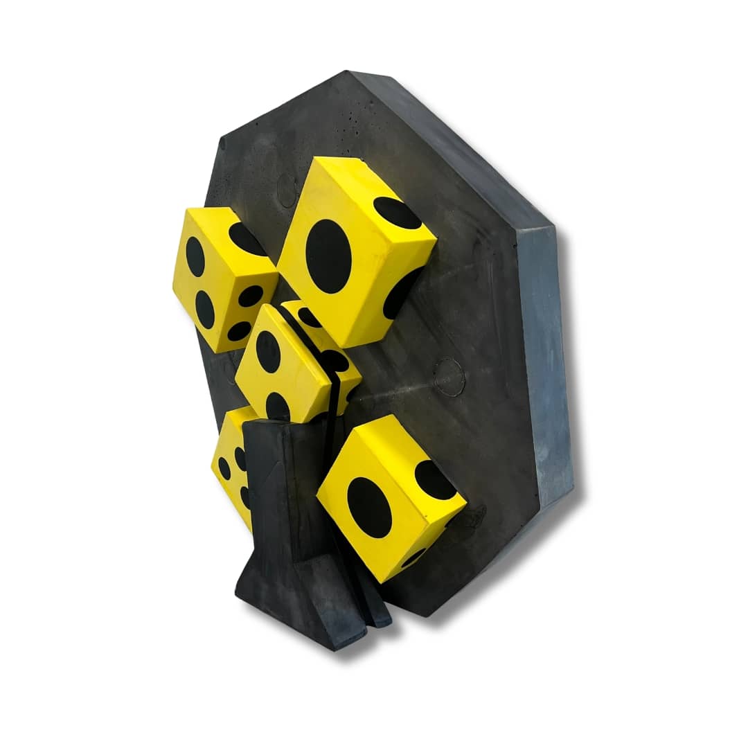 Black and yellow dice holder with four yellow dice on a white background
